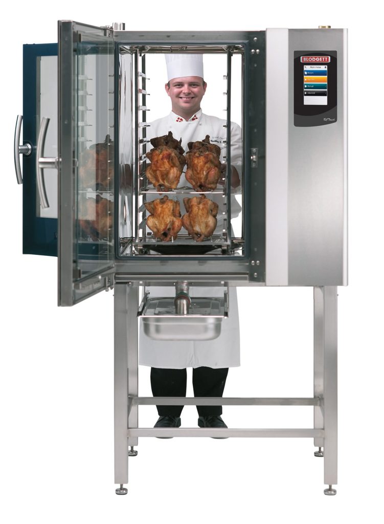 chef looking through passthrough oven with chicen